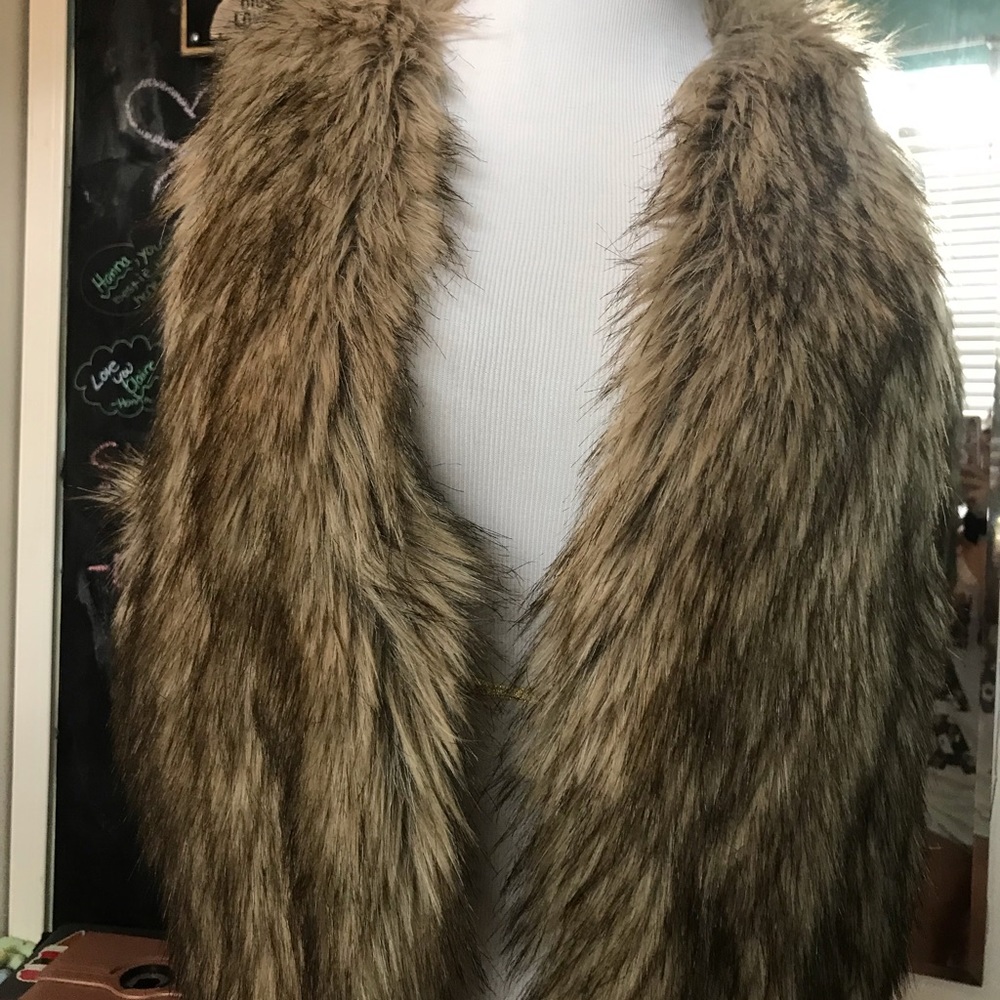A sleeveless fur coat